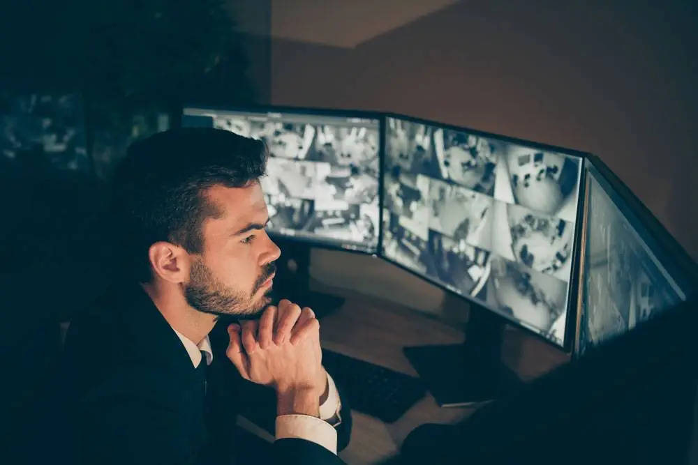 Security Guard checking CCTV Cam